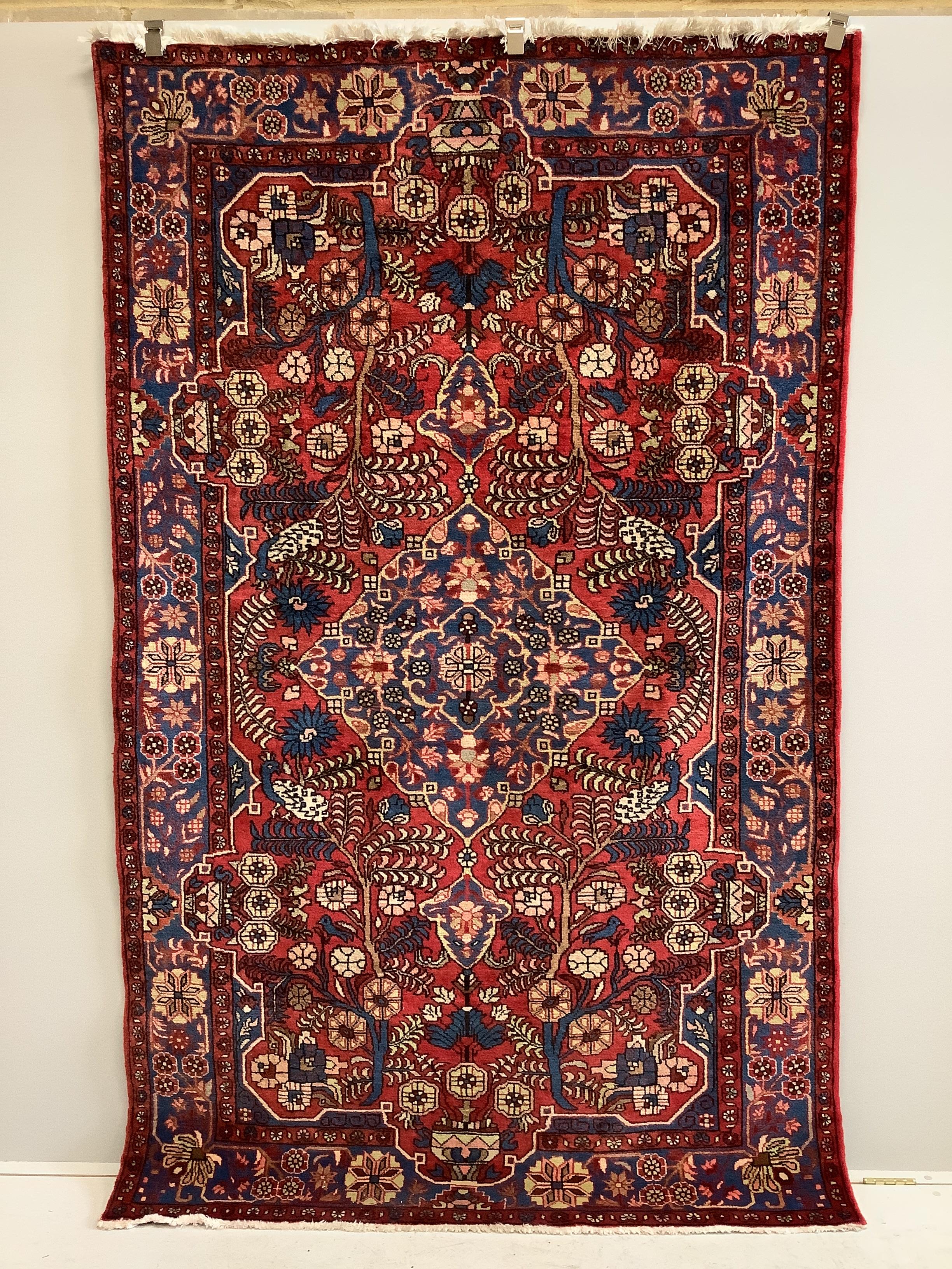 A North West Persian red ground rug, 204 x 150cm	